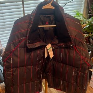 Women's Air Jordan puffer jacket size XL, NWT.